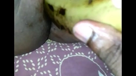Tamil girl play with banana